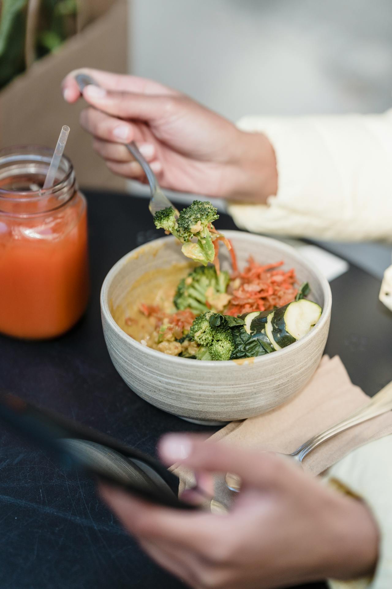 eating and scrolling on phone